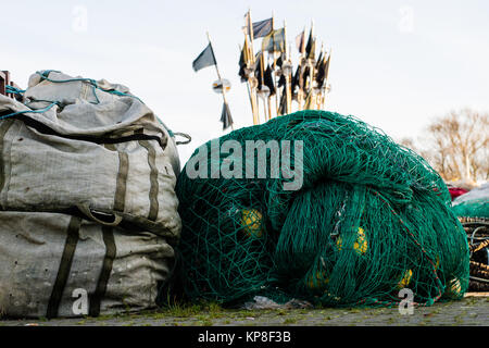 Fishing nets and ropes on a fishing boat. Fishing boats and fishing nets in a sea port. Autumn season Stock Photo