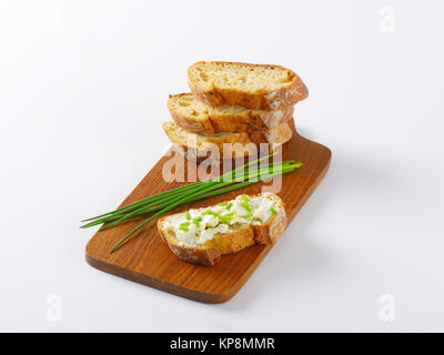 crispy baguette slices, one slice with cheese Stock Photo