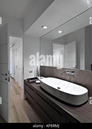 foreground of washbasin in the modern bathroom with wood floor Stock Photo