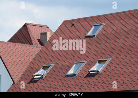 Decorative metal tile on a roof Stock Photo