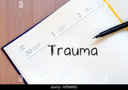 Trauma write on notebook Stock Photo