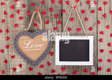 Empty wooden blackboard sign and heart shape frame Stock Photo