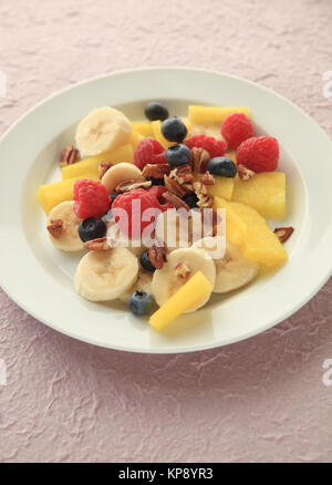 Berries, melon and banana fruit salad Stock Photo