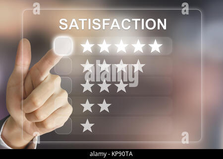 business hand pushing satisfaction on virtual screen Stock Photo