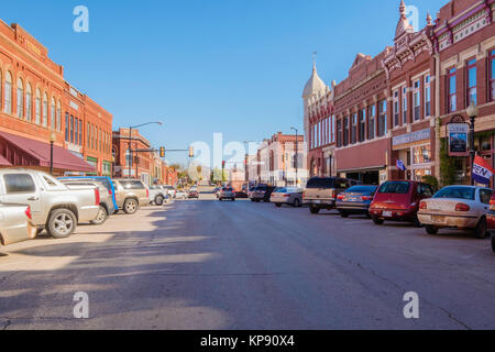 Oklahoma street in the historic district of Guthrie, Oklahoma, USA, with vintage early 1900s buildings. Stock Photo