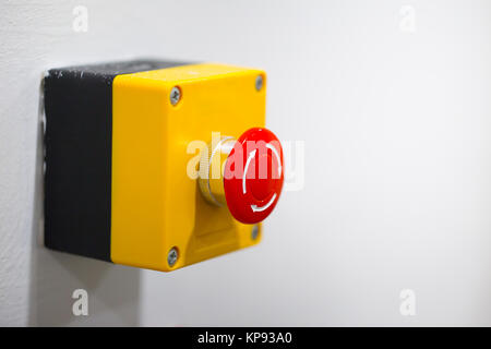 Emergency Stop Button fire warning alarm on wall Stock Photo