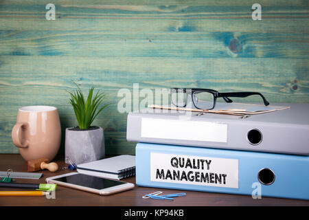 quality management concept. Binders on desk in the office. Business background Stock Photo