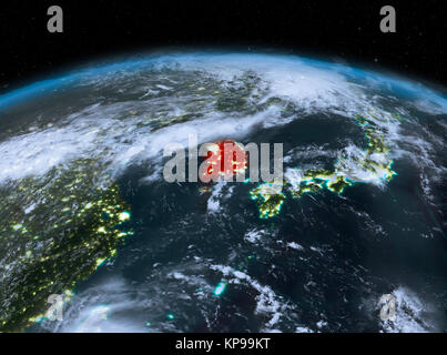 Satellite night view of South Korea highlighted in red on planet Earth ...