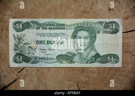 $ 1 bahamas bill on wooden front Stock Photo