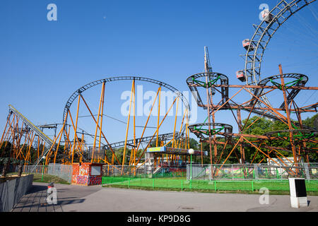 Super 8er Bahn and Dizzy Mouse roller coasters, part of Giant Ferris Wheel in Prater amusement park in Vienna city, Austria, Europe Stock Photo