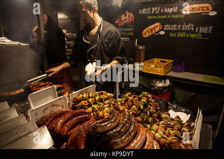 Christmas fast food kiosk with grilled meat at Old Town square in Prague, Czech Republic, 2nd of December 2017 Stock Photo