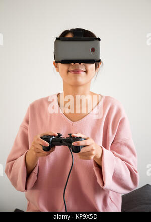 Young Woman wearing virtual reality devices Stock Photo
