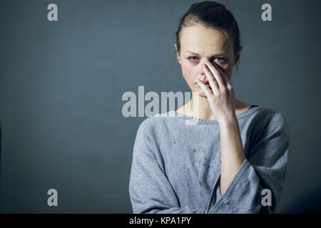 Young woman suffering from severe depression/anxiety/sadness Stock Photo