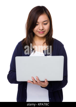 Asian Woman use of the notebook computer Stock Photo