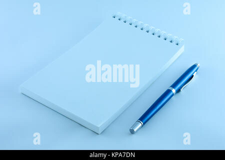 notepad and blue pen to record Stock Photo