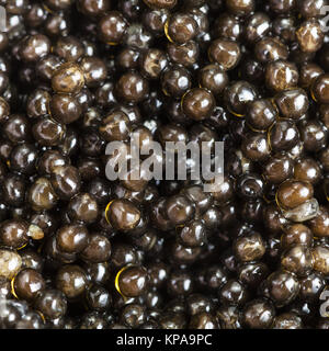 background from black sturgeon caviar close up Stock Photo