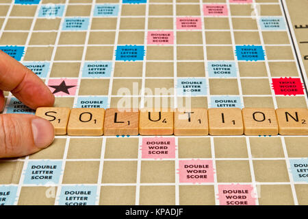 word solution spelled with scrabble tiles Stock Photo