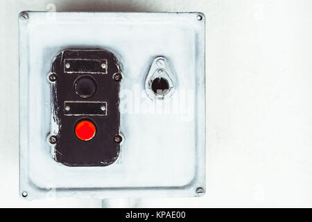 partial view of old Soviet industrial machining workstation. switch with buttons on which it is written in Russian: start and stop Stock Photo