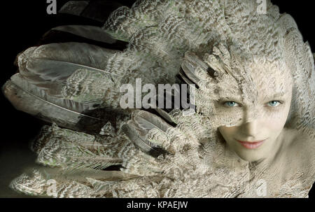 Beautiful artistic portrait of a girl with plumage Stock Photo
