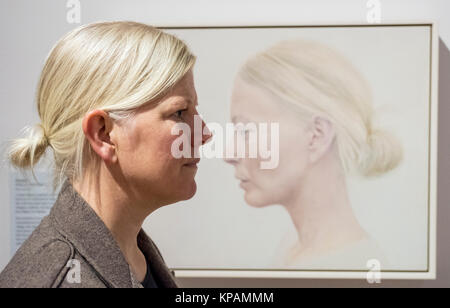 Edinburgh, Scotland, United Kingdom. 14 December, 2017.   Artist Angela Repping  and her painting Profile at The BP Portrait Award 2017 which  opens at the Scottish National Portrait Gallery on 16 December 2017. Credit: Iain Masterton/Alamy Live News Stock Photo