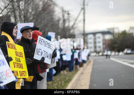 Fairfax, VA, USA. 14th December, 2017. The 60th vigil in memory of the Sandy Hook Elementary School massacre takes place outside of the National Rifle Association on the fifth anniversary of the shooting. Credit: Nicole Glass / Alamy Live News. Stock Photo