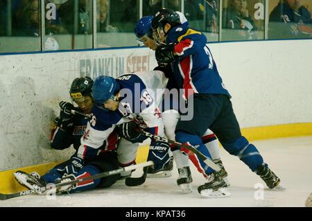 Dumfries, Scotland, 14 December 2017. Great Britain and Korea battle for the puck during their 2018 IIHF Ice Hockey U20 World Championship Division II, Group A match in Dumfries. Credit: Colin Edwards/Alamy Live News. Stock Photo