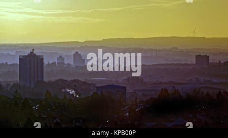 Glasgow, Scotland, UK  15th December. UK Weather: Freezing overnight temperatures ice warning and bright sunshine over silhouetted  towers of southern Glasgow. Credit Gerard Ferry/Alamy news Stock Photo