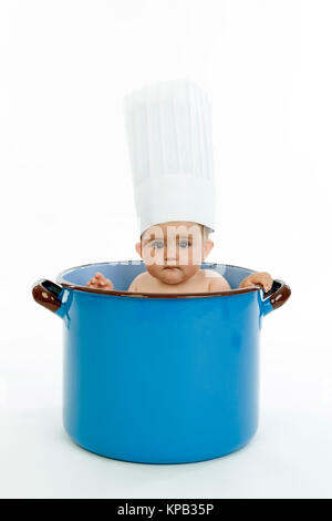 Model release, Kleinkind mit Kochhaube im Kochtopf - little child with chef's cap in cooking pot Stock Photo