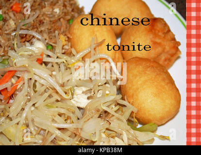 Chinese Take Out Food on a plate.  Deep fried chicken balls, chicken chop suey and chicken fried rice with vegetables Stock Photo