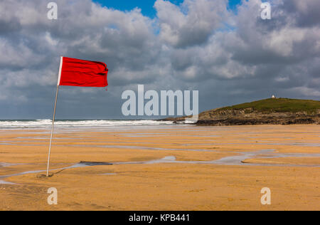 Red flag during Atlantic Storm Brian on Fistral Beach, Cornwall, UK Stock Photo