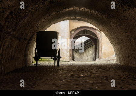 Carriage waiting for its horses in tunnel Stock Photo