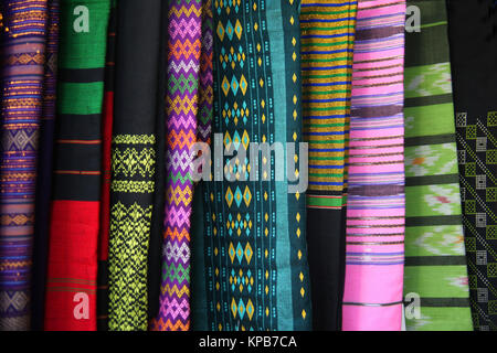 Traditional womans clothing made of colourful silk fabric with different fabrics, Yangon, Myanmar. Stock Photo