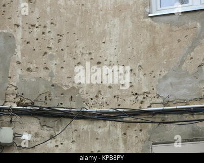 Bullet holes in wall Stock Photo