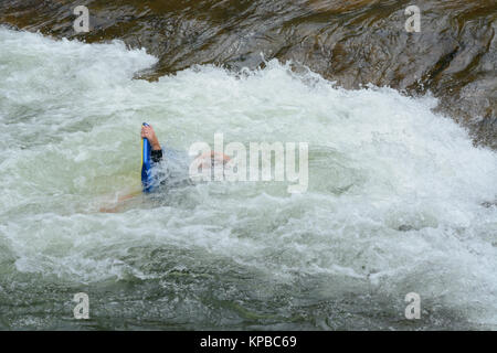 Float rafting wipe out on white water rapids at Clear Creek White Water Park in Golden Colorado Stock Photo