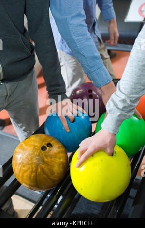 picking up bowling balls Stock Photo