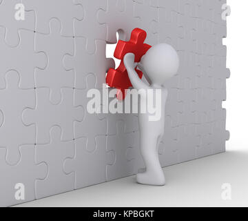 Person is completing wall puzzle Stock Photo