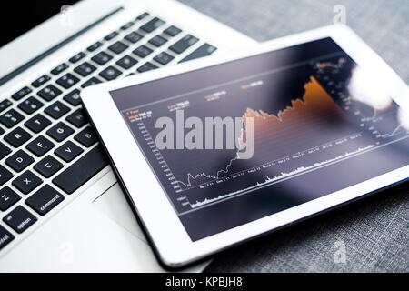 Stock market chart on digital tablet pc Stock Photo