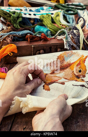 set of threads of different types,colors and lengths on wooden background Stock Photo