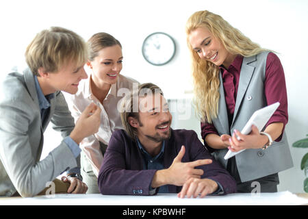 business partners looking at tablet  Stock Photo