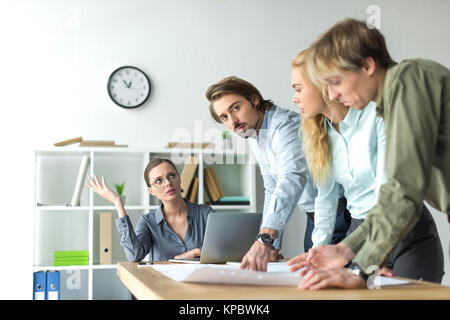 Stressed colleagues at office meeting Stock Photo