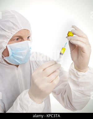 Man with syringe and vial Stock Photo