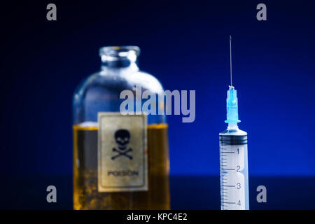 Vintage poison bottle and syringe Stock Photo