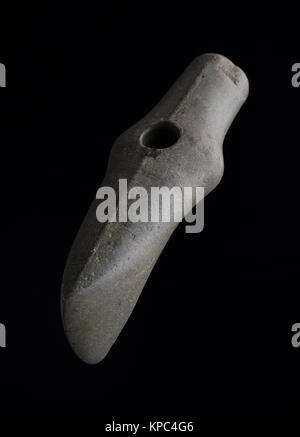 Prehistoric stone axe Stock Photo