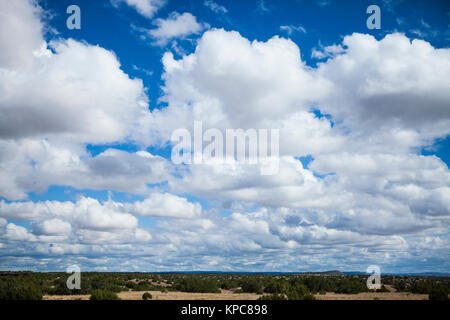 white cumulus clouds on a blue sky, New Mexico Stock Photo