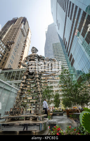 NEW YORK - JUL 22: Superhero sculpture by Antonio Pio Saracino on July 22, 2014 in Bryant Park, New York. Bryant Park is a 9.603-acre public park loca Stock Photo