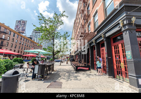 NEW YORK CITY - JUL 22: Ninth avenue on July 22, 2014 in New York. 9th Avenue, known as Columbus Avenue is a southbound thoroughfare on the West Side  Stock Photo