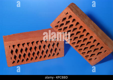 Brick on blue background Stock Photo