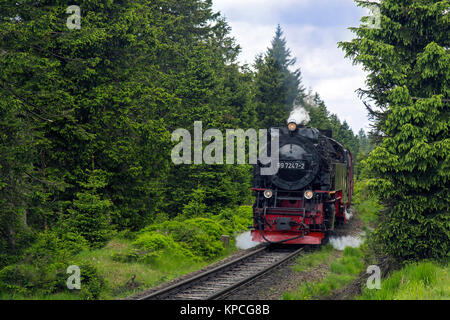 Steam train riding the Brocken Narrow Gauge railway line at the Harz National park, Saxony-Anhalt, Germany Stock Photo