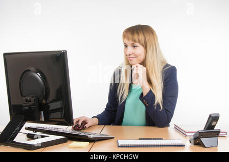 Office a specialist working at the computer in the office Stock Photo