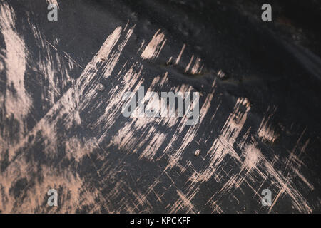 Gold metal texture background with wrought-iron picture is not in focus. Close-up. Stock Photo